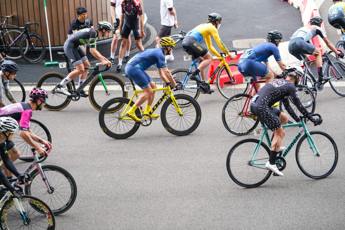 Image in a post titled 'global fixed-gear cycling events(that you can actually enter)' | image of cyclists at event | fixed gear focus Image of cyclists at event.